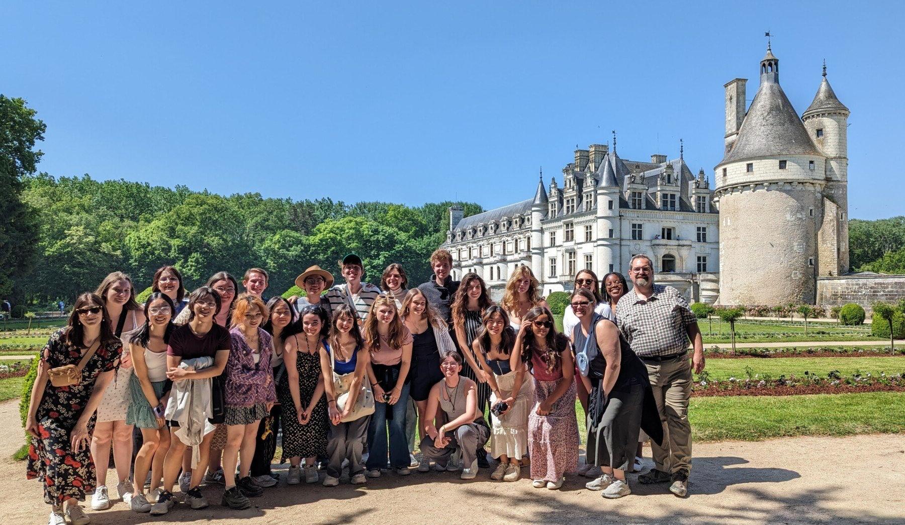 students group photo in front of castle